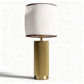 Table lamp with textured fabric shade and ribbed metal base 25 x 25 x 50cm